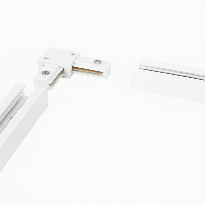 Detalle de conexión de la pieza en L con tramos de carril monofásico blanco