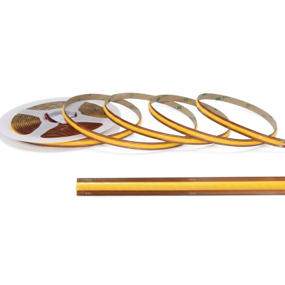 Rollo y detalle de tira LED COB 24V con tecnología de corte libre milimétrico QUOLED